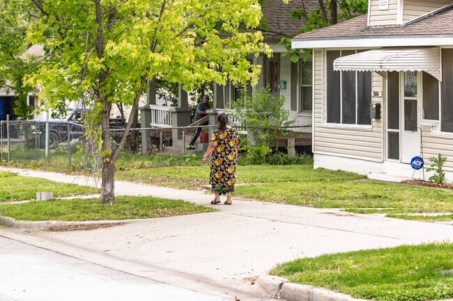 Emerson residents enjoy an afternoon stroll along the neighborhood sidewalks.