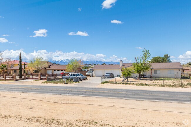 Golden Arrow Ranchos properties are usually fenced in ranch homes, and a dusting of sand lines the roads.
