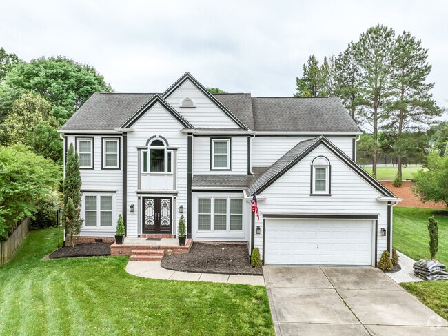 A new traditional two-story home with a single-car garage in Highland Creek.