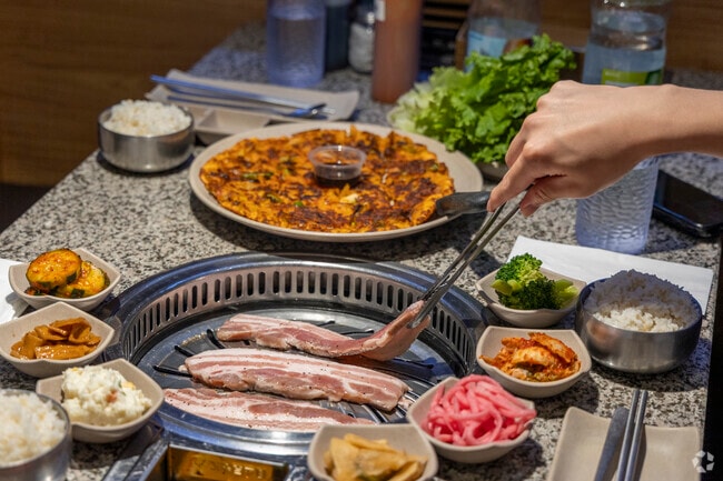 At Star Barbecue of Savoy, diners can cook marinated meats right at the table.