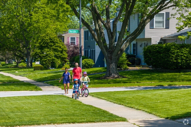 A family walks to a local park in Maple Brook.