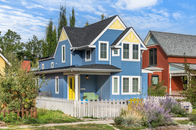 There are brightly colored traditional style homes in the Northeast neighborhood.