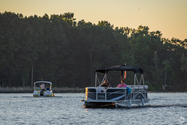 Enjoy a peaceful evening on your boat while watching the sunset on Portage Lakes.