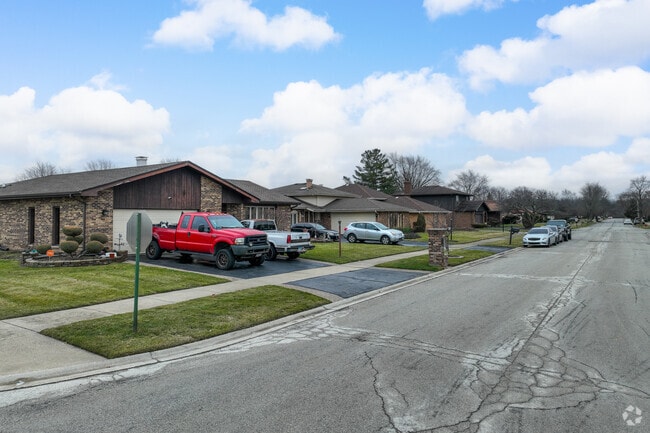Tree-lined streets in Lansing feature a mix of unique homes.