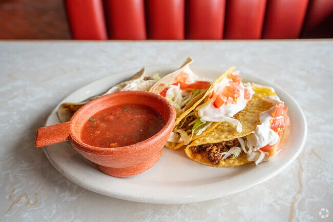 Order some yummy tacos at El Vecino in Forestdale.