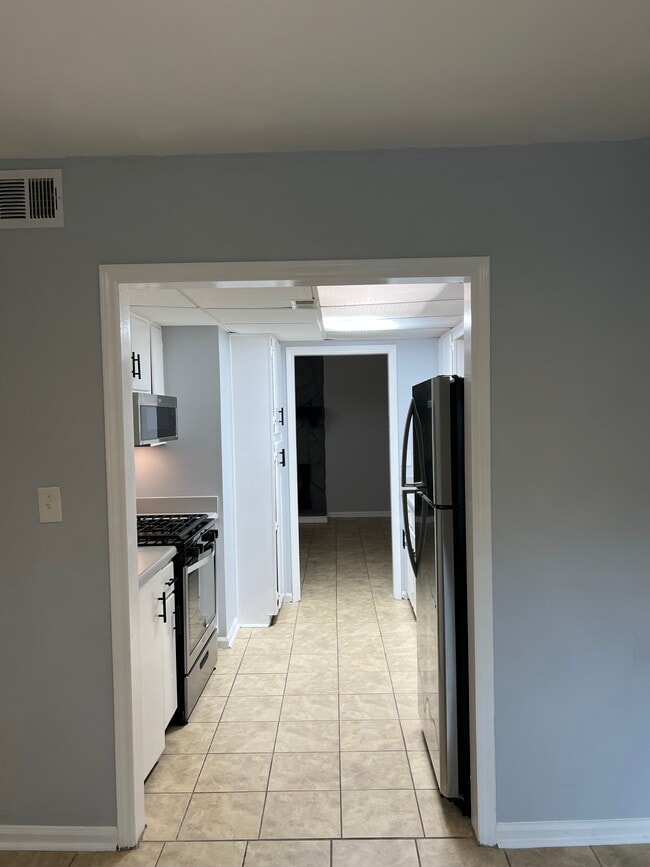 Direct view from dinning through kitchen and living room