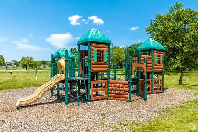 The log-cabin-themed playground of Windflower Park harkens back to the city's origins.
