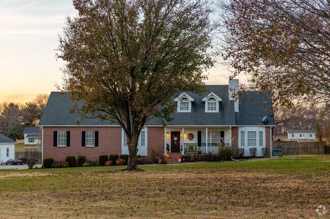 Colonial style homes with dormer windows are seen peppered throughout the Cross Plains area.