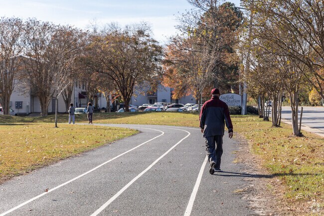 Residents enjoy the walking track at Planters Park in Holy Neck.