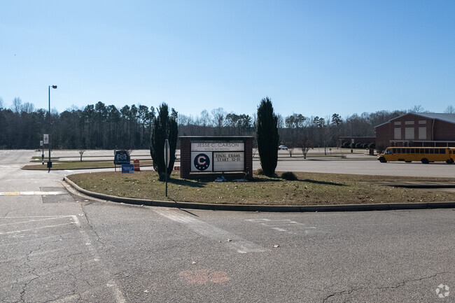 The entrance plaque at Jesse C. Carson High School.