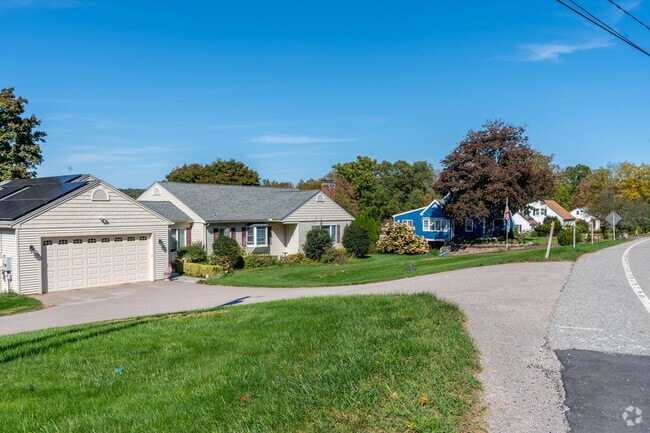 Homes in East Haddam exhibit serene suburban charm with well manicured lawns.