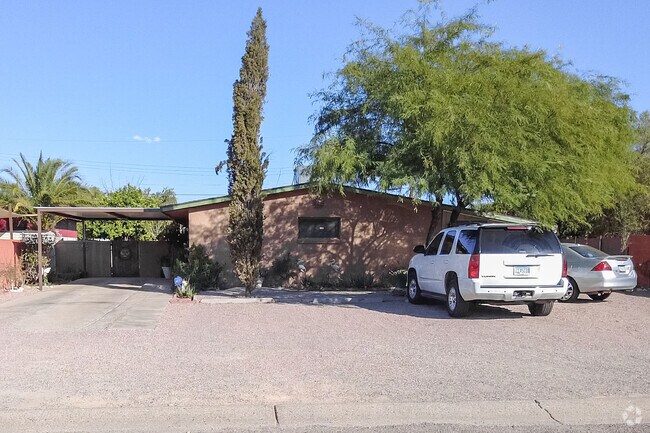 Carports and gravel lots make for versatile parking at Dodge Flower Tucson homes.