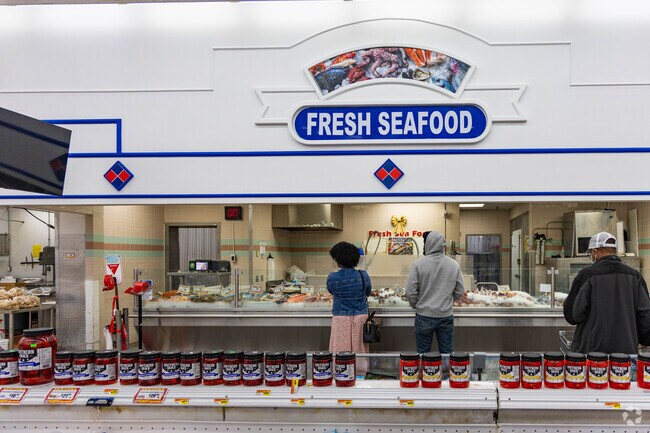 Mangonia Park residents shopping for fresh seafood at the Presidente Supermarket.