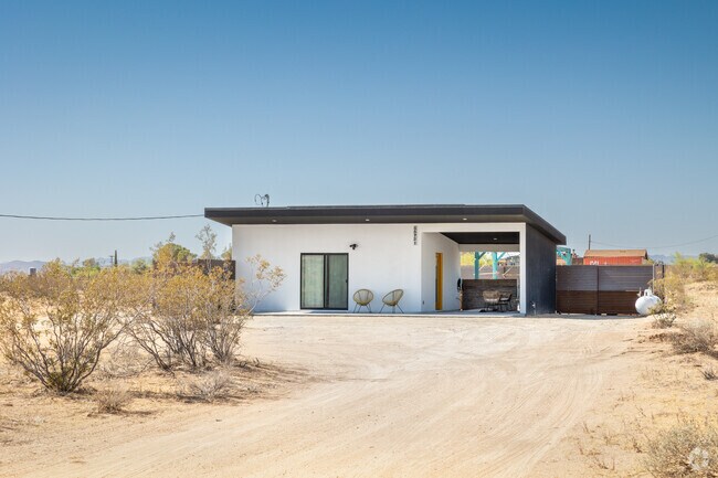 A minimalist desert home blends seamlessly into Landers' natural surroundings.