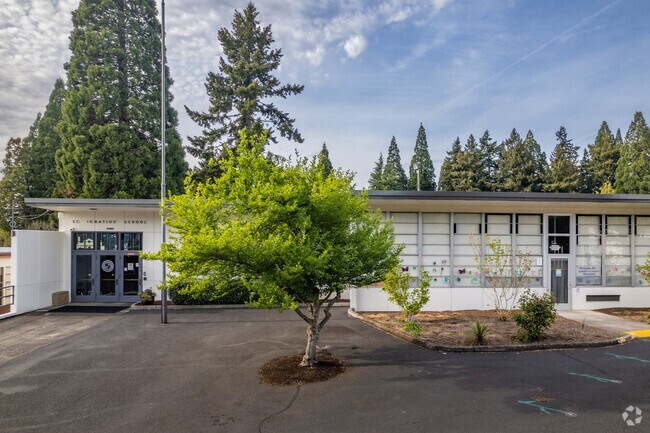 Front of school with planted tree at St Ignatius School.