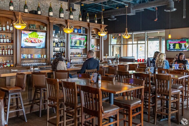 The Brass Rail is a versatile eatery where you can chow down on wings at the TV-lined bar.