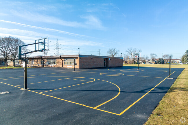 Maddock Elementary School features a blacktop with a full basketball court.