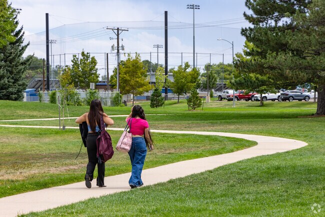 Walk along the paved paths that run through Loomiller Park in Longmont.