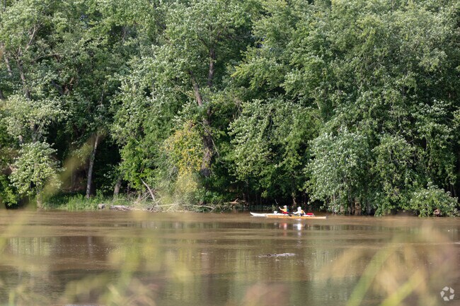 Fenton City Park is across the road from the Meramec River where you can see people boating.