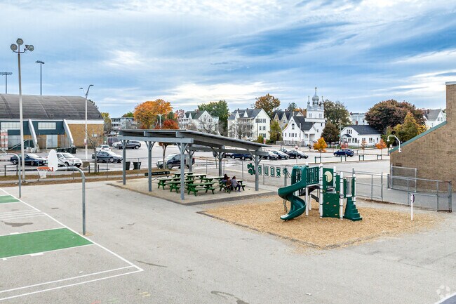 A covered shelter and small playground is located on the Beech Street playground