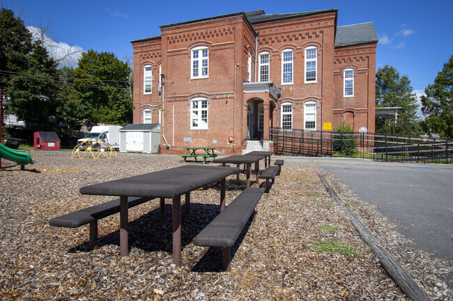 Young students can take a rest outside on the benches behind the Greenleaf Academy.