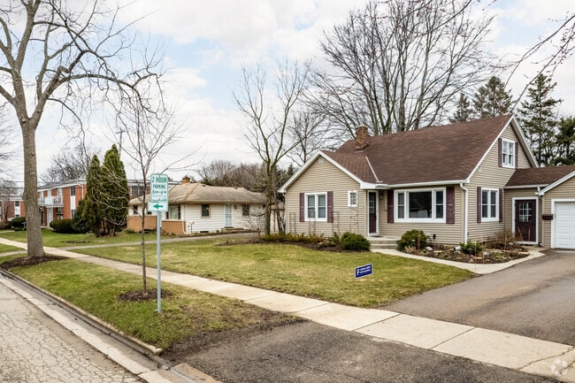 Colonial/Cape Cod, ranch, and brick duplex, along a street in Odana Hills.