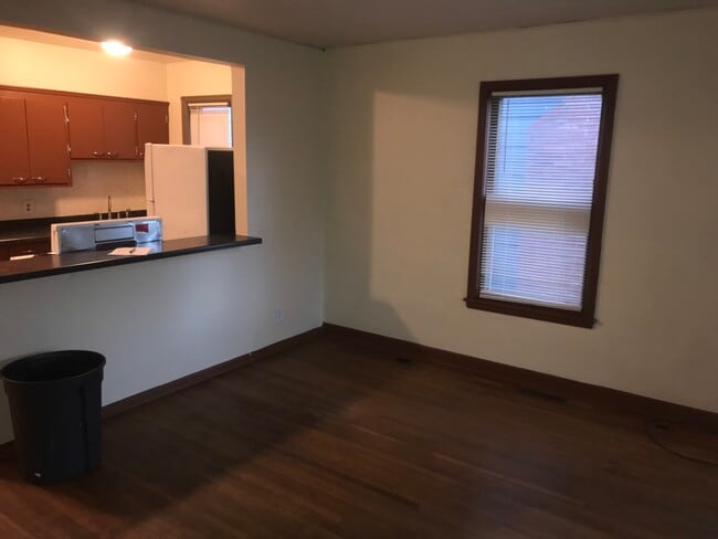 Living room with bar to kitchne