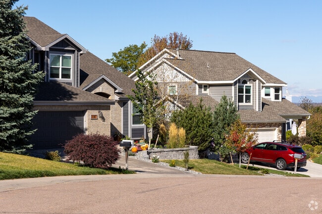 Contemporary Craftsman homes line tree-shaded streets in The Woodlands.
