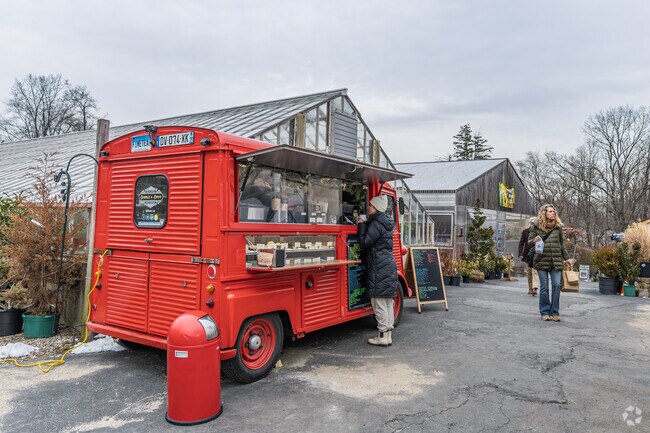 Locals enjoy goods from food trucks at the Westport Farmers Market near Westport Village.