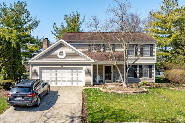 A traditional two-story home in Shannon Heights features an attached two-car garage.