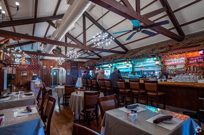 Enjoy a seat at the bar with friends at Anthony's Trattoria near Jacksonwald.