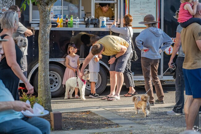 Families gather for Music on the Square before grabbing dinner nearby.