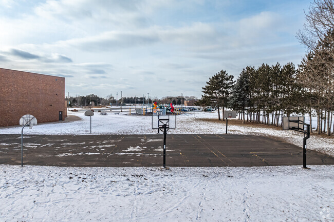 Catch the spirit of friendly games at the basketball courts near the school.
