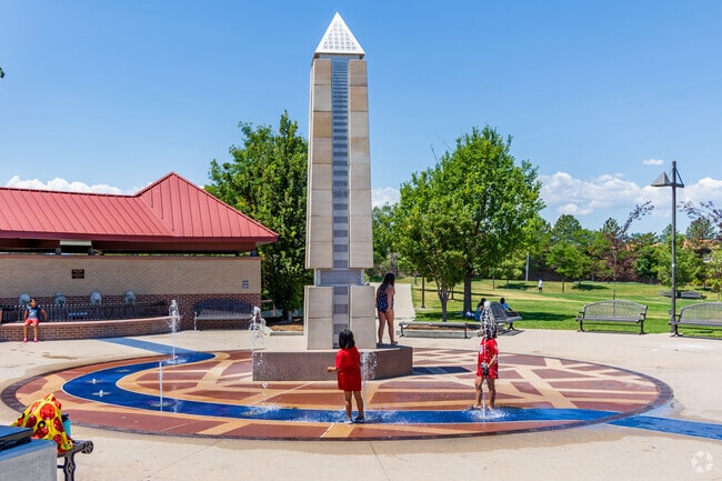 Kids seek out the splash pad at McFall Park along with other parkgoers when temperatures peak.
