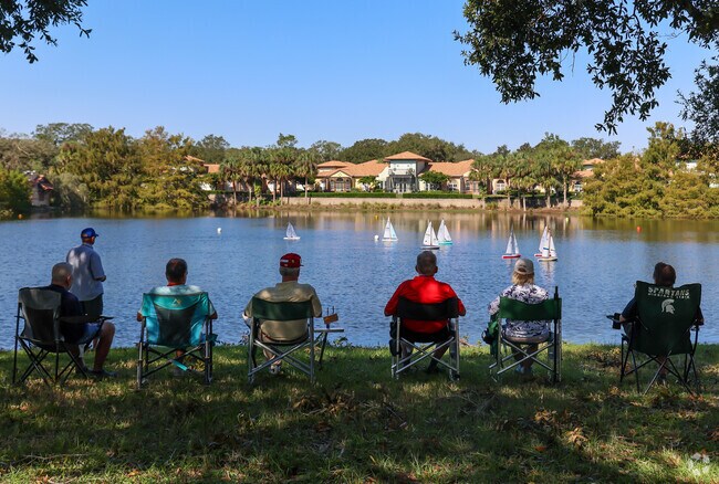 Harmeswood of Belle Aire can take a load off and watch the remote boat races at Lake Mira Mar.