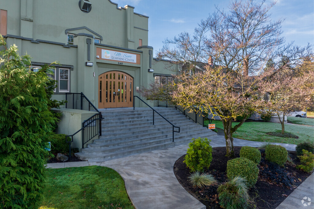 Kids walk up a grand staircase to enter Mt. Scott Learning Center on Holgate Blvd in Portland.