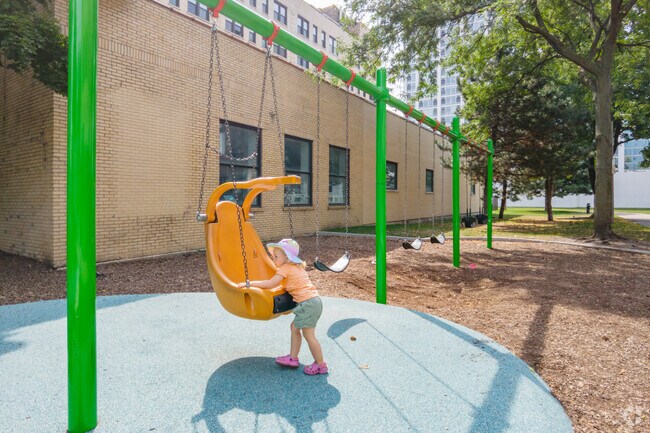 Gill Park's swing set is made to suit East Lakeview locals of any size.
