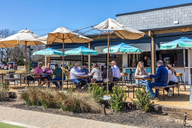 Locals bask in the afternoon sun and enjoy a good meal at Standard Service in Heath.