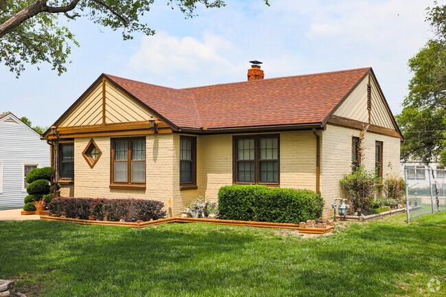 This home in North Central has a great-looking combination of brick and wooden siding.
