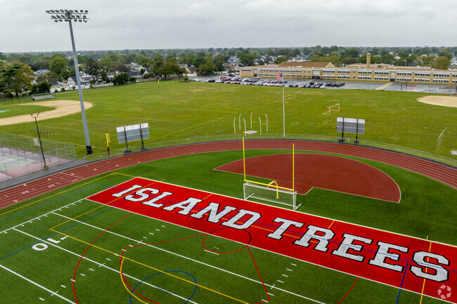 Island Trees High School in Levittown has 716 students in grades 9-12 with a ratio of 11 to 1.