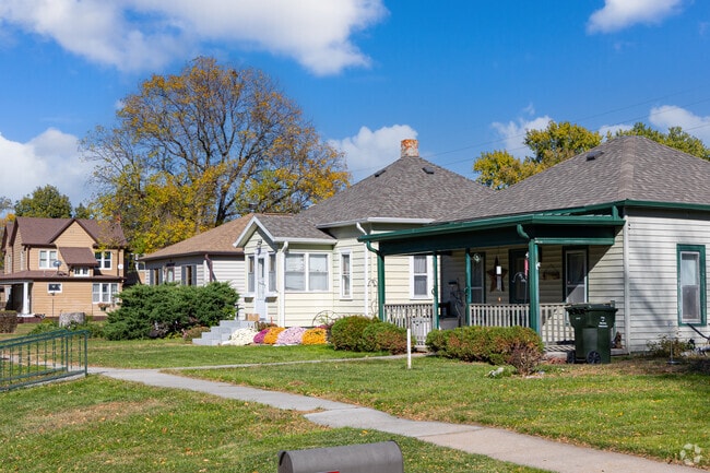 Front porches and mature trees shape these Minden cottages for neighborly chats.