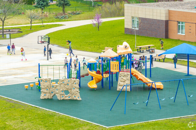 Students of Maple Grove Elementary enjoy modern playground equipment and ample outdoor space.