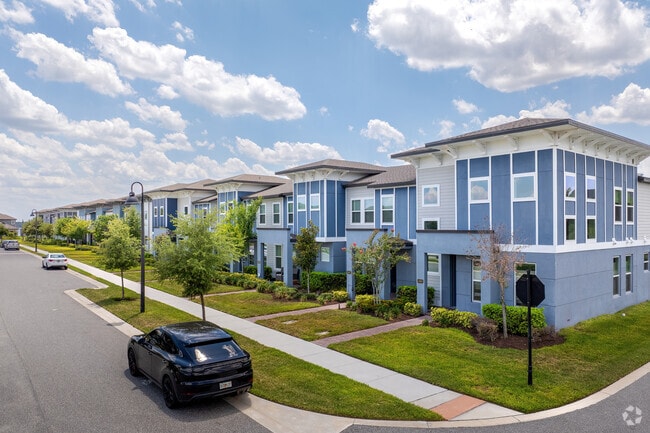 New townhouses, with a beautiful blue hue, offer convenient living for Dr. Phillips residents.