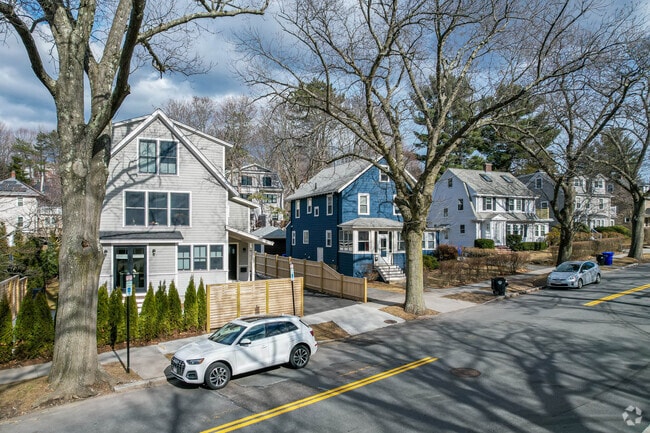 A row of homes in Chestnut Hill, Middlesex, has driveways and street parking.