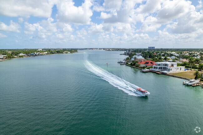 Boaters enjoy the calm waters of Naples Bay on a sunny afternoon by Royal Harbor.