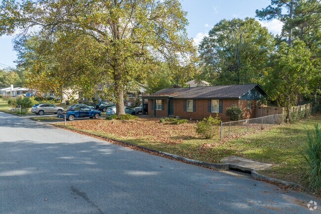 Ranch style homes in Westside list on leafy lots with tall shade trees.
