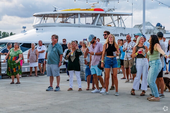 Friends are enjoying Friday Night Live! on the Pier in downtown Wilmington.