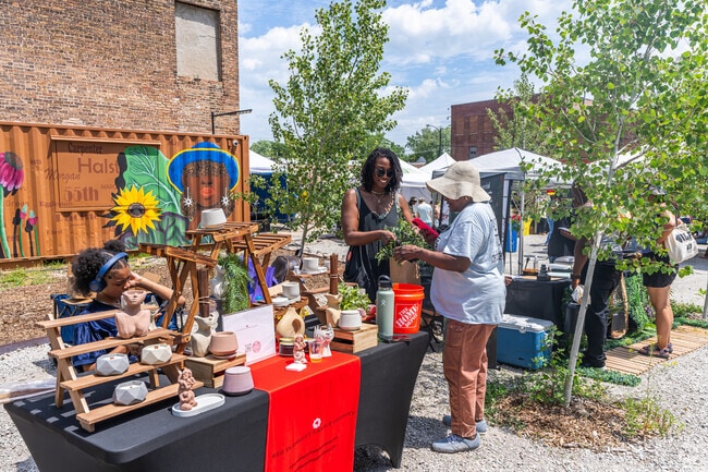 There are many smiles at the Englewood Village Market in Englewood.