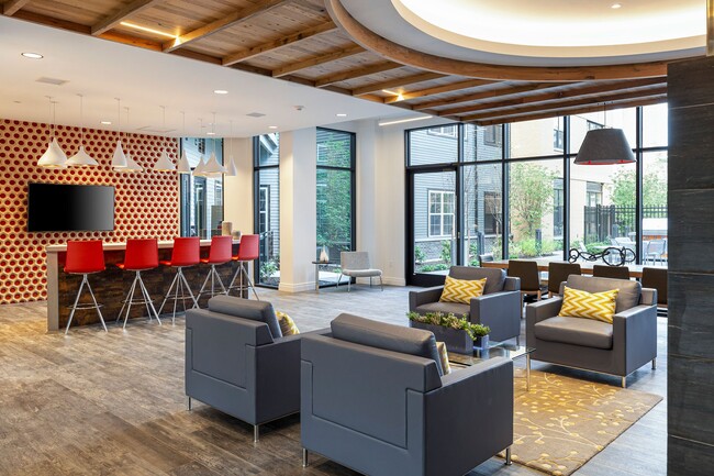 The Entertainment Lounge features bar seating and large-screen TV