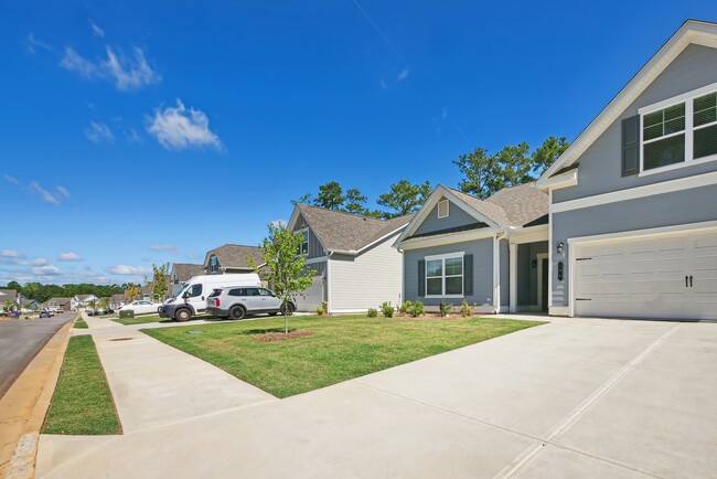Exterior shot of Salem Oaks, two story homes with a private driveway and attached garage.